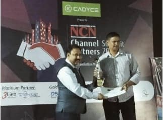 An award is presented to a winner at the NCN Channel Partners Summit 2020 in Pune