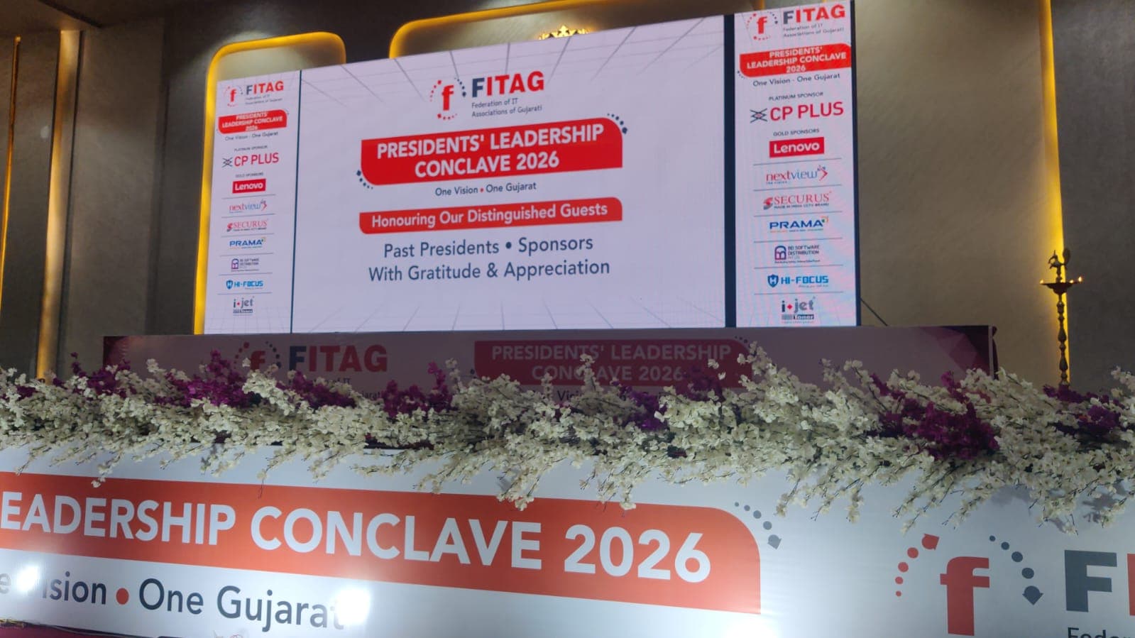 The stage at the FITAG Presidents' Leadership Conclave 2026 — 'One Vision, One Gujarat' — honouring past presidents and sponsors