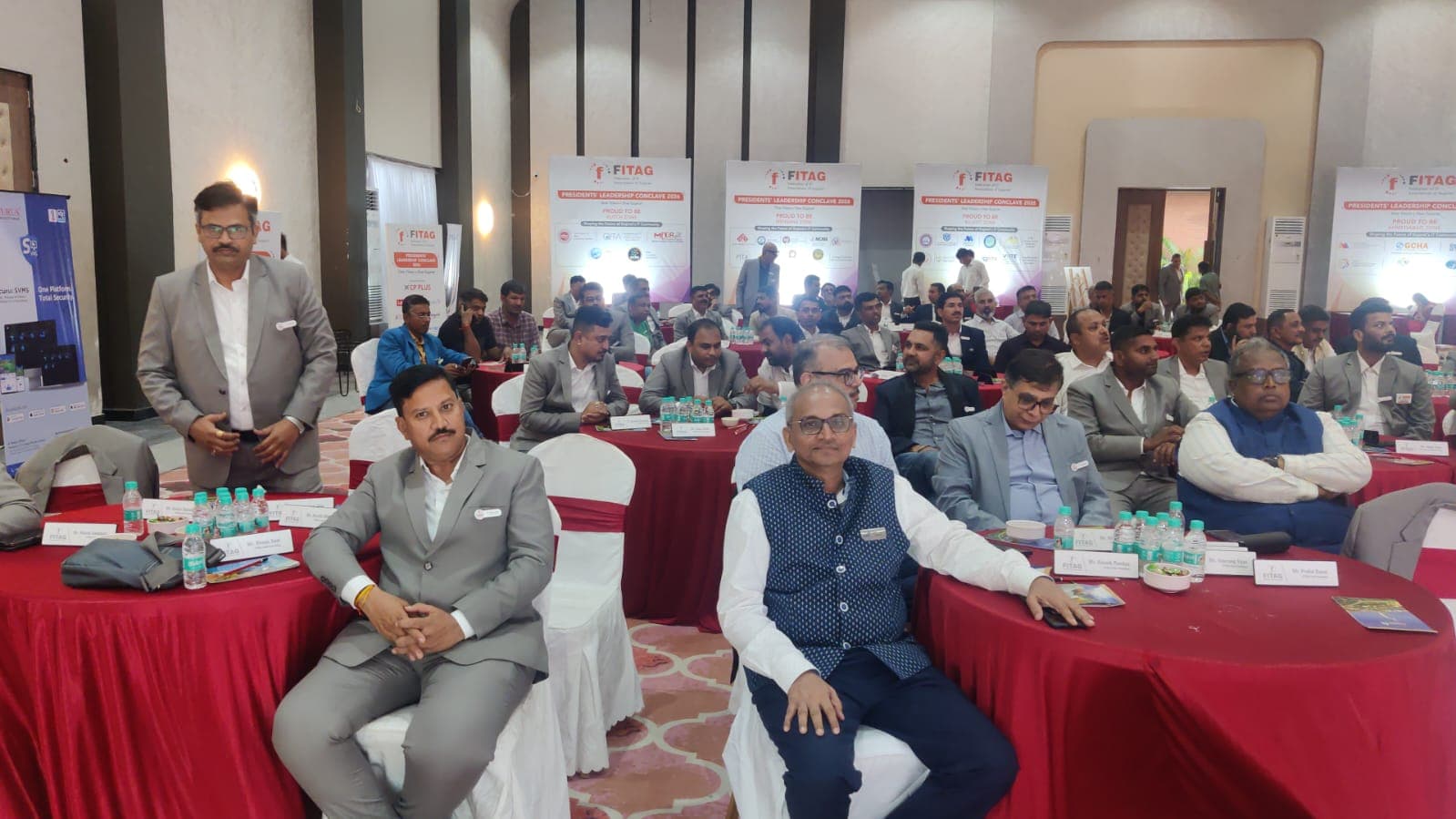 Association leaders seated at the conclave, with zone banners recognising FITAG's regional IT communities