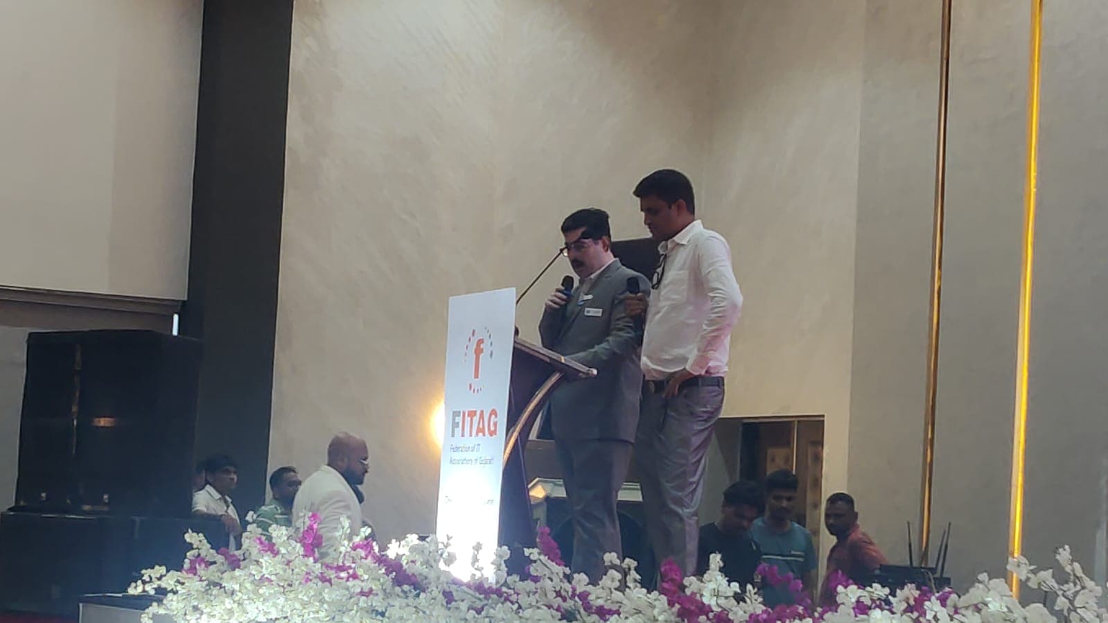 Addressing delegates from the FITAG podium during the Presidents' Leadership Conclave 2026