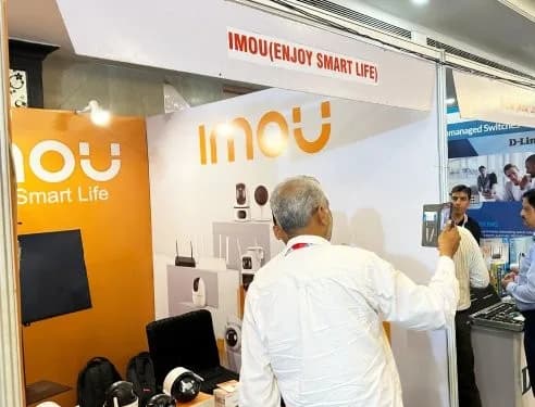 Visitors explore the latest smart security solutions at the IMOU booth.