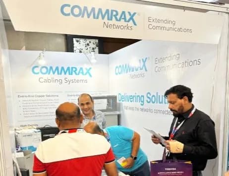 Channel partners engage with the team at the Commrax Networks booth.